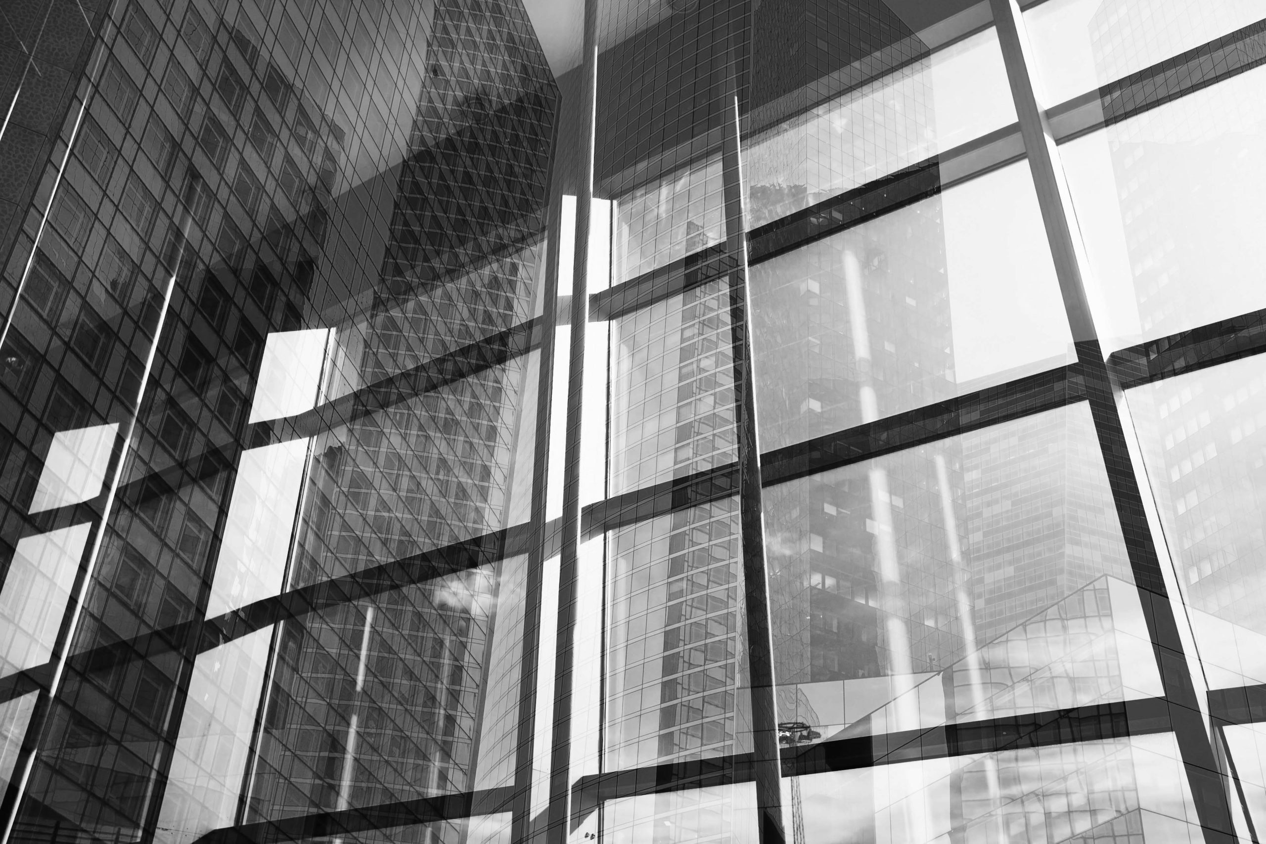 A black and white photo of some windows in a building.