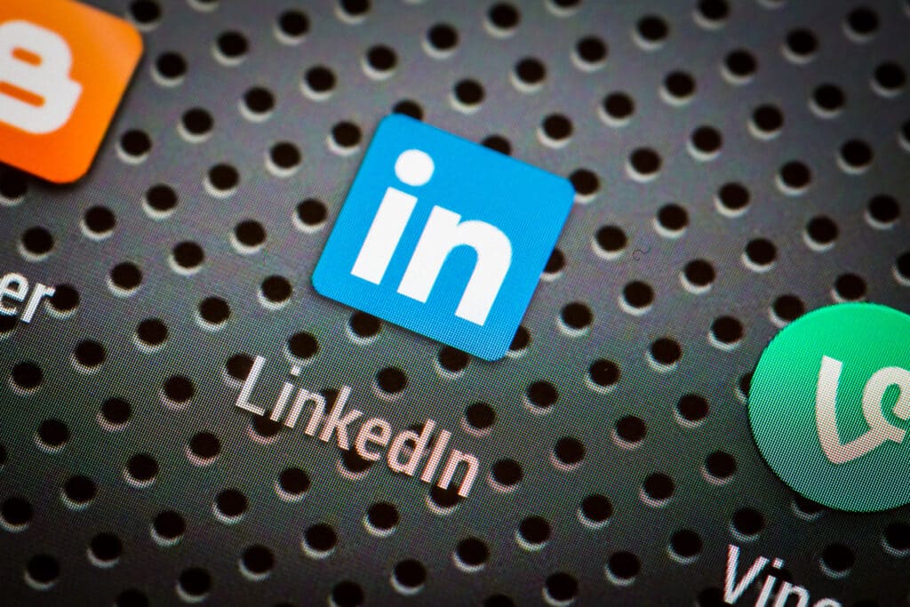 A close up of the linkedin logo on a phone